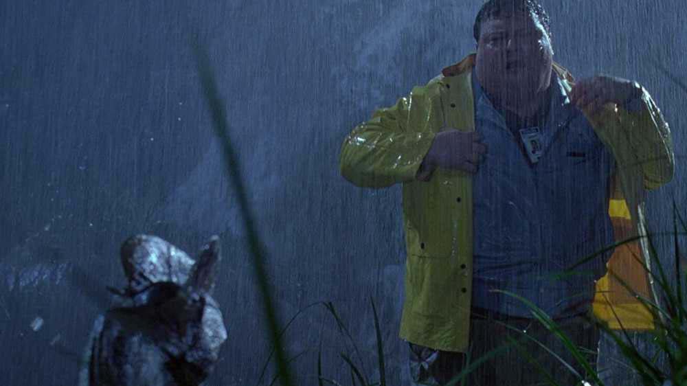 Nedry from Jurassic Park fearfully looking at a small dinosaur